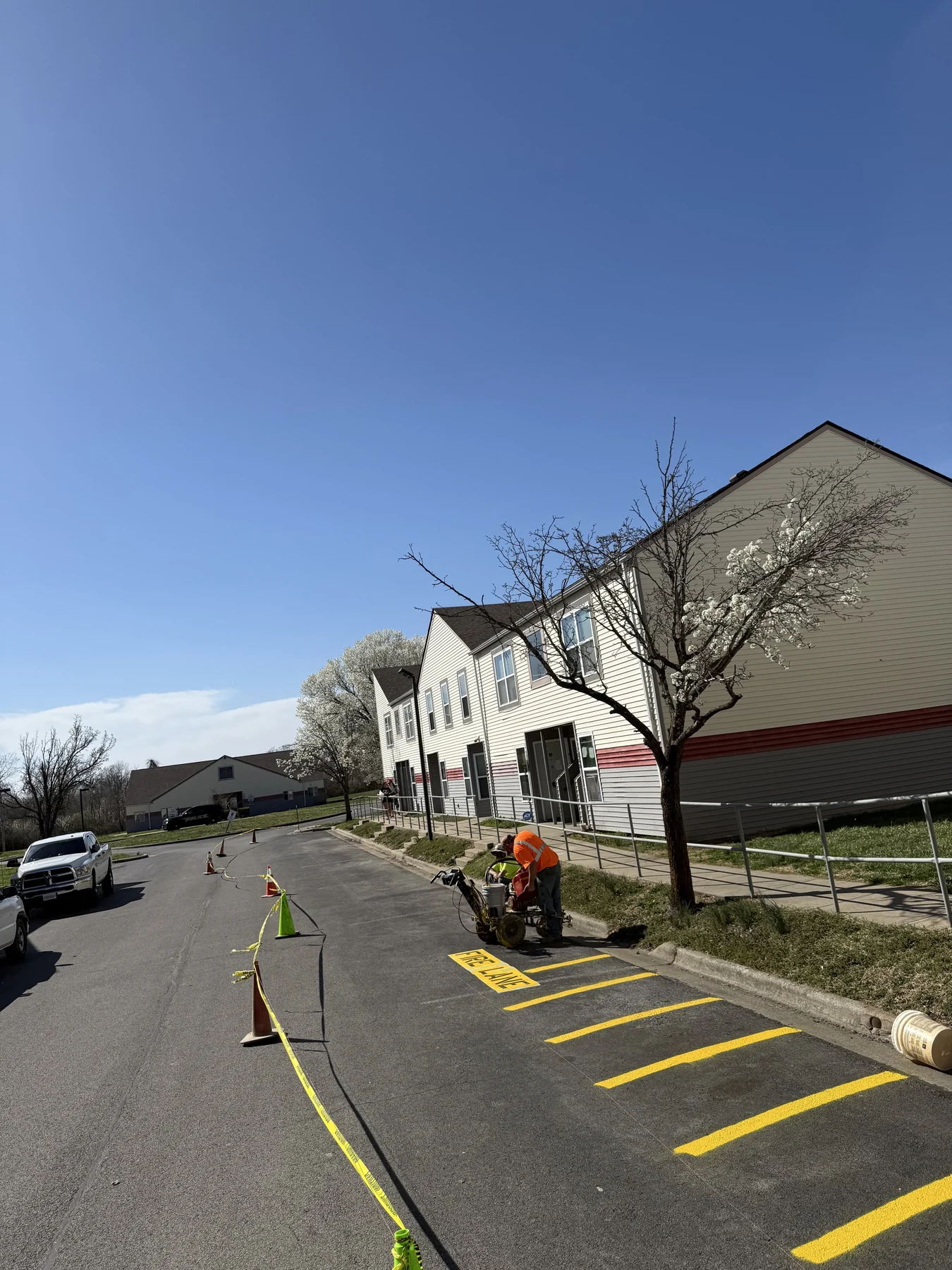 Crew striping a fire lane at an apartment community